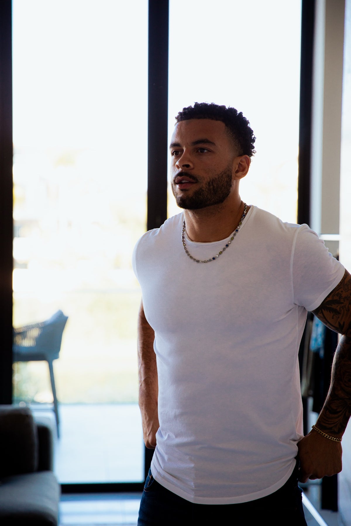 Man wearing a white Dann T-shirt