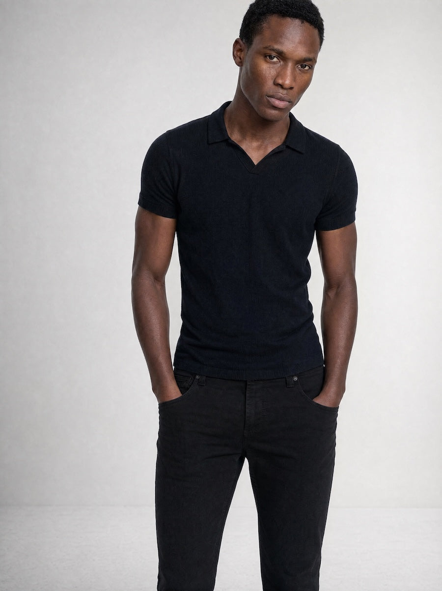 Front profile of MONFRÈRE Bond Polo Noir men's black stretch viscose polo shirt.