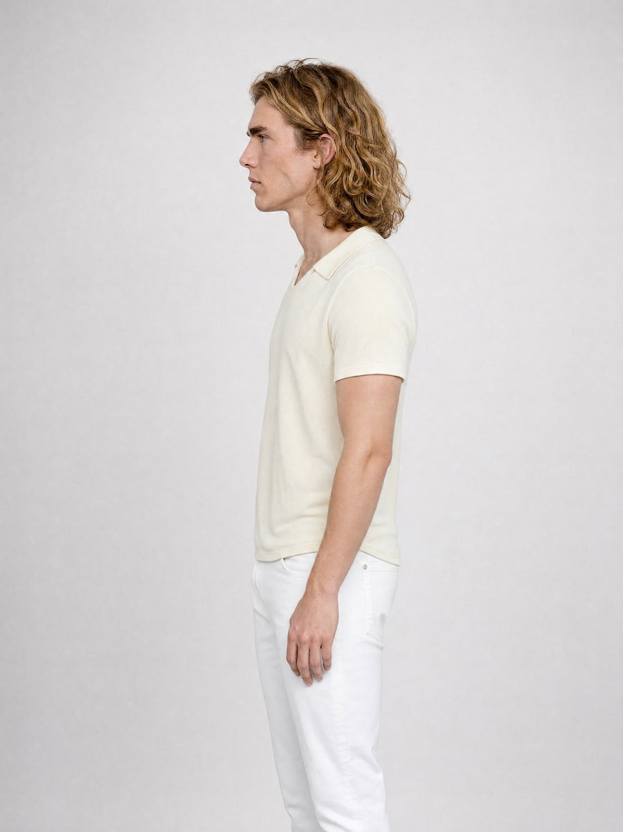 Side profile of MONFRÈRE Bond Polo Taupe men's off white ivory stretch viscose polo shirt.