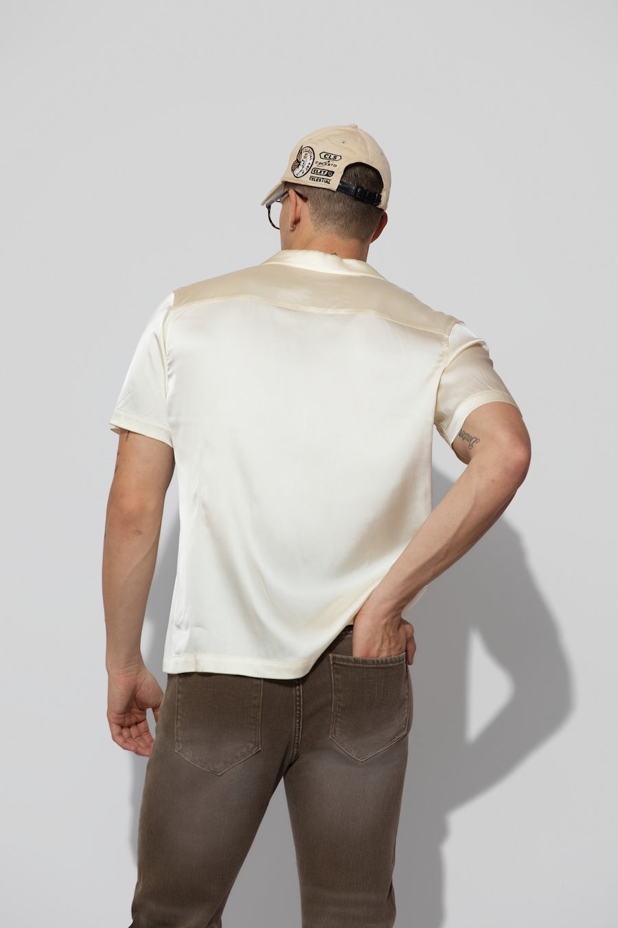 Back profile of MONFRÈRE Bond Shirt Silk Ivory men's off white ivory stretch viscose silk bowling shirt.