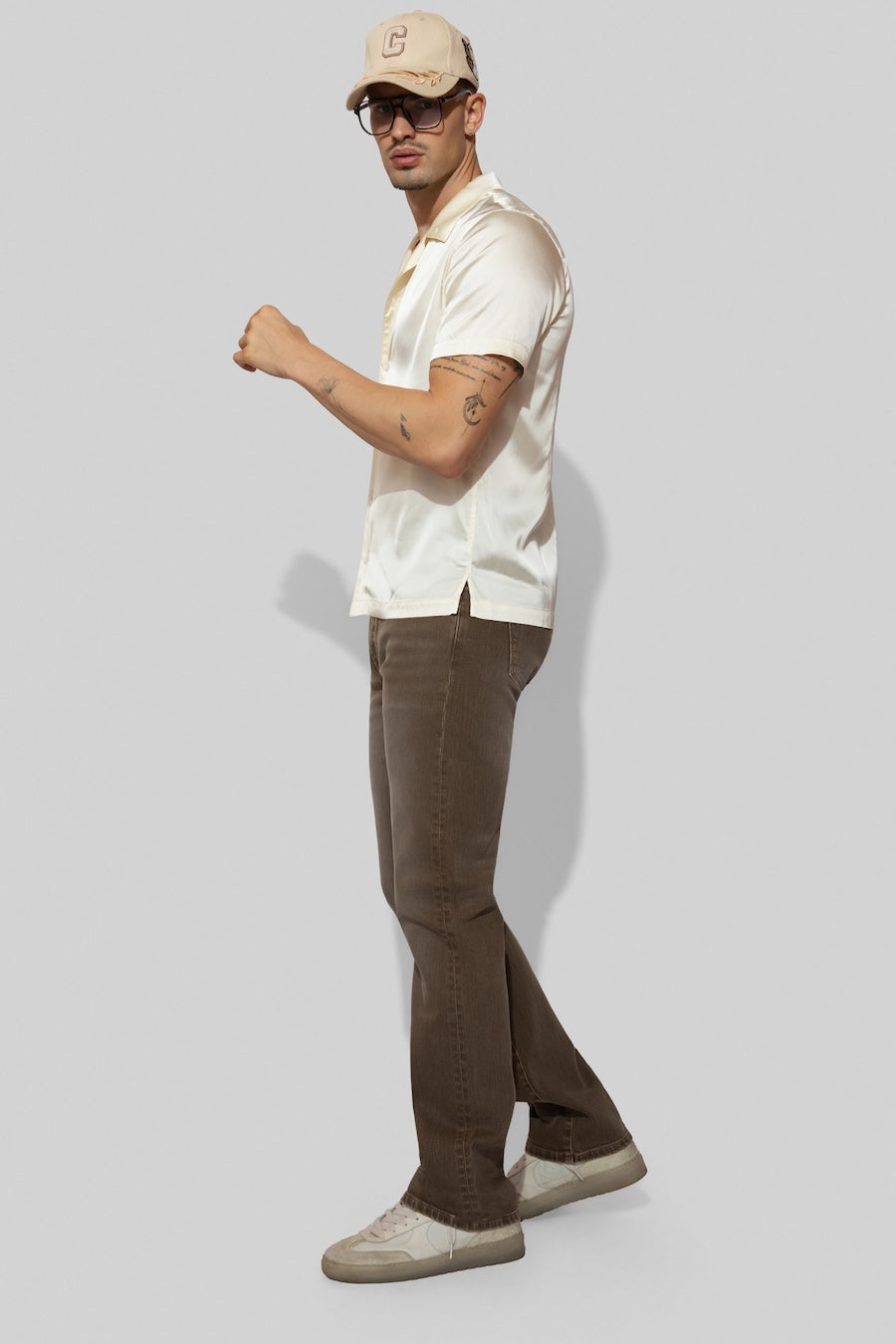 Model wearing MONFRÈRE Bond Shirt Silk Ivory men's off white ivory stretch viscose silk bowling shirt.