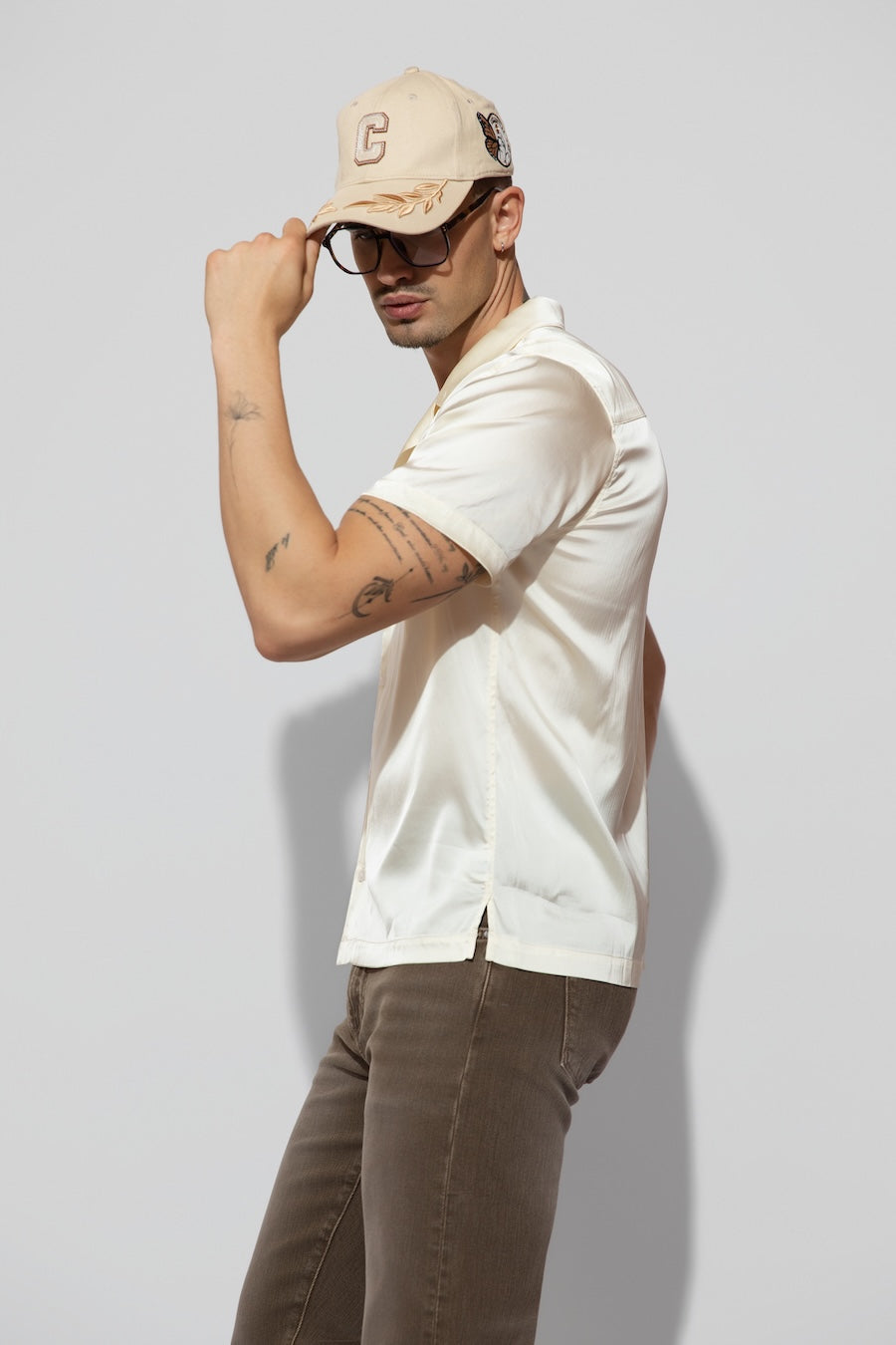 Side profile of MONFRÈRE Bond Shirt Silk Ivory men's off white ivory stretch viscose silk bowling shirt.