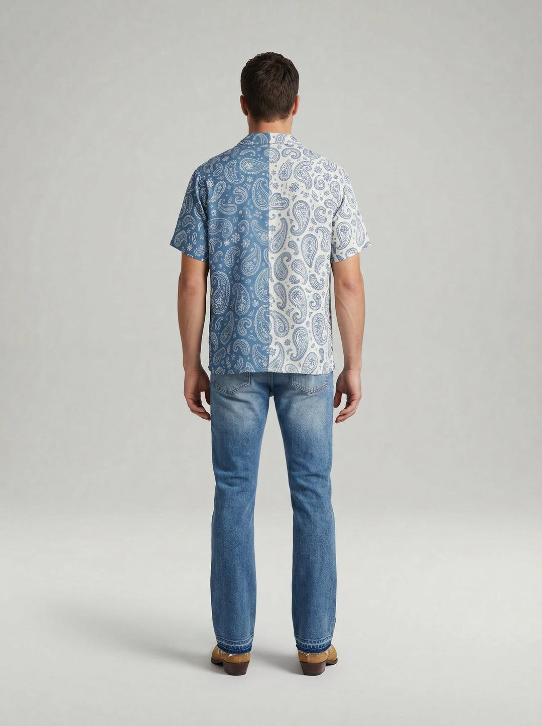Back profile of MONFRÈRE Bond Shirt Silk Outlaw men's paisly blue and cream stretch viscose silk bowling shirt.