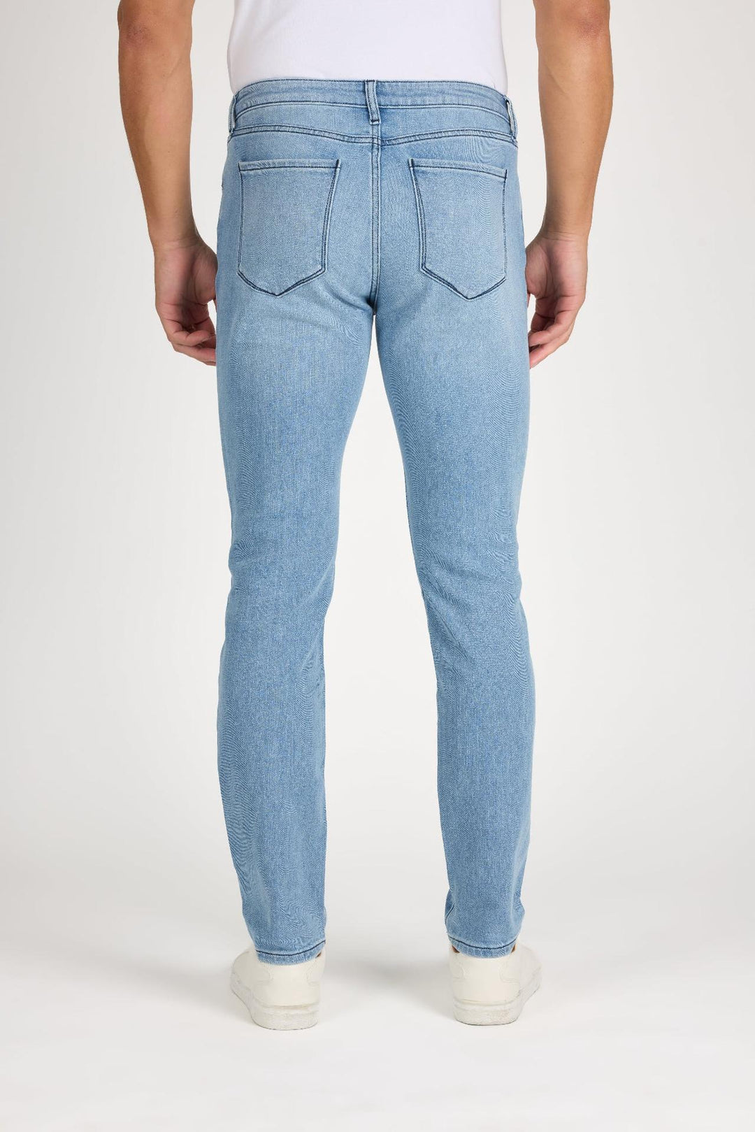 Back profile of MONFRÈRE Brando Belmar men's blue Japanese stretch denim five pocket slim jean.
