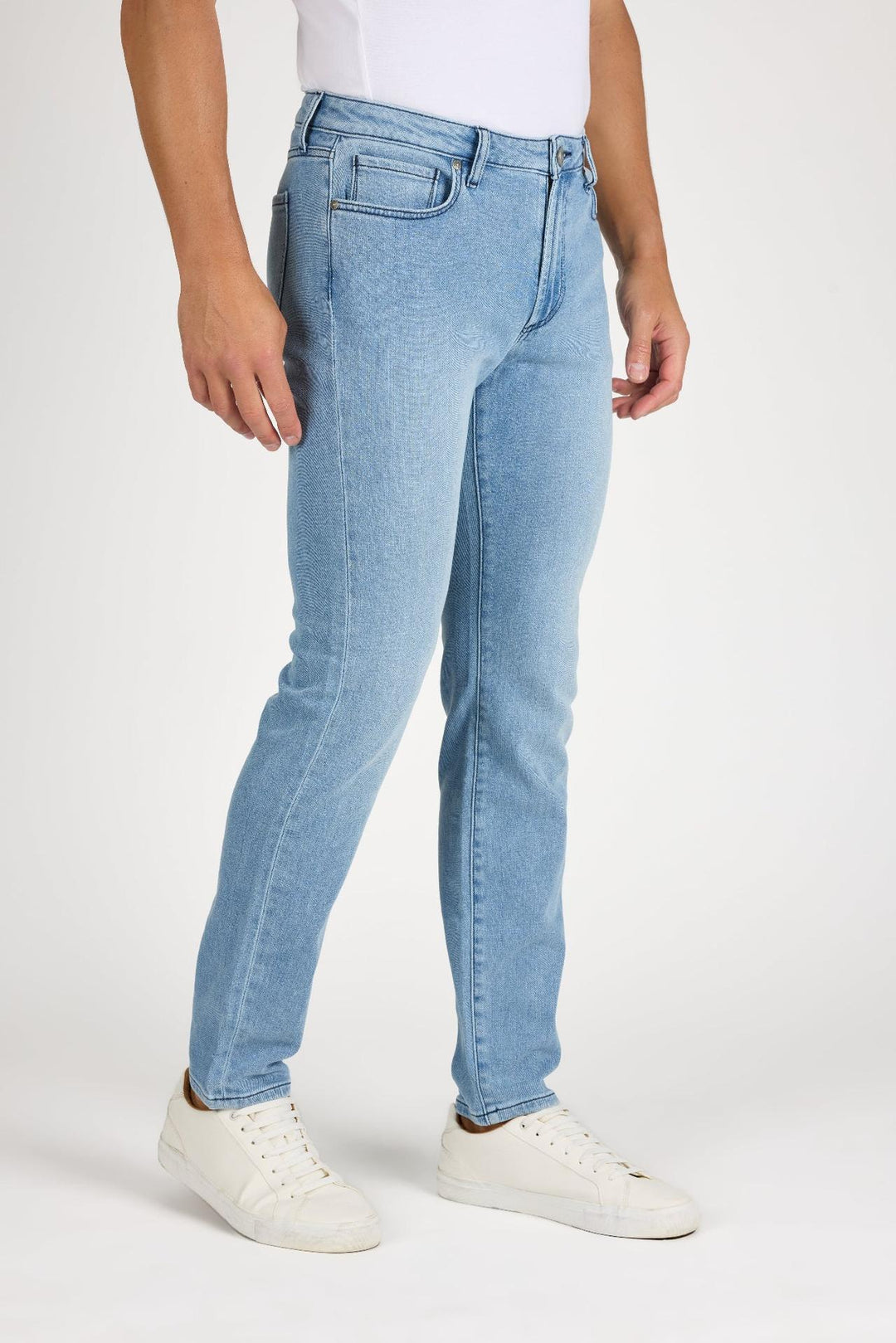 Side profile of MONFRÈRE Brando Belmar men's blue Japanese stretch denim five pocket slim jean.