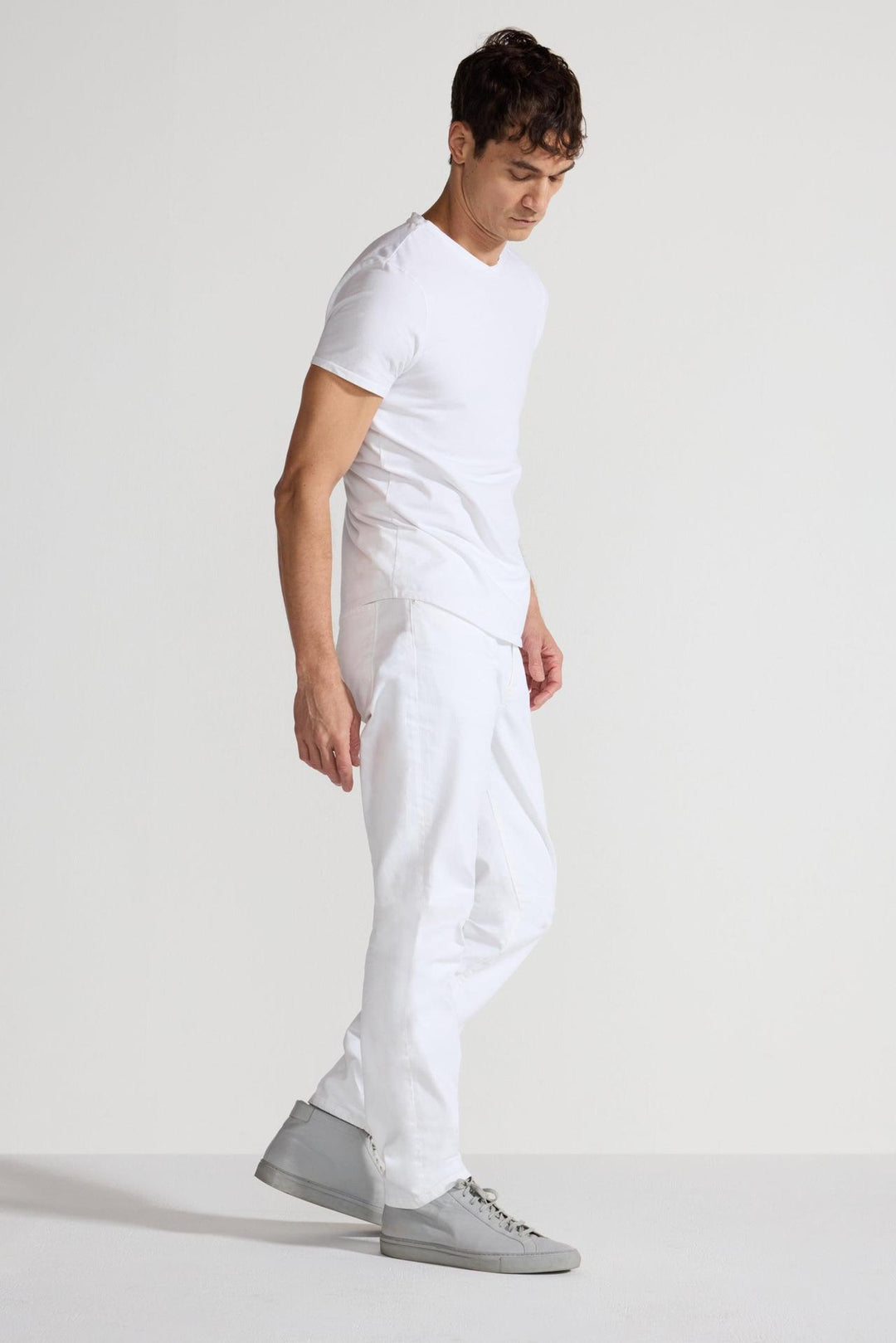Side profile of MONFRÈRE Brando Blanc men's white Japanese stretch denim five pocket slim jean.