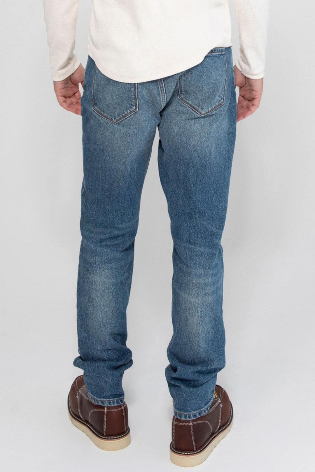 Back profile of MONFRÈRE Brando Encino men's blue stretch rigid vintage denim five pocket slim jean.