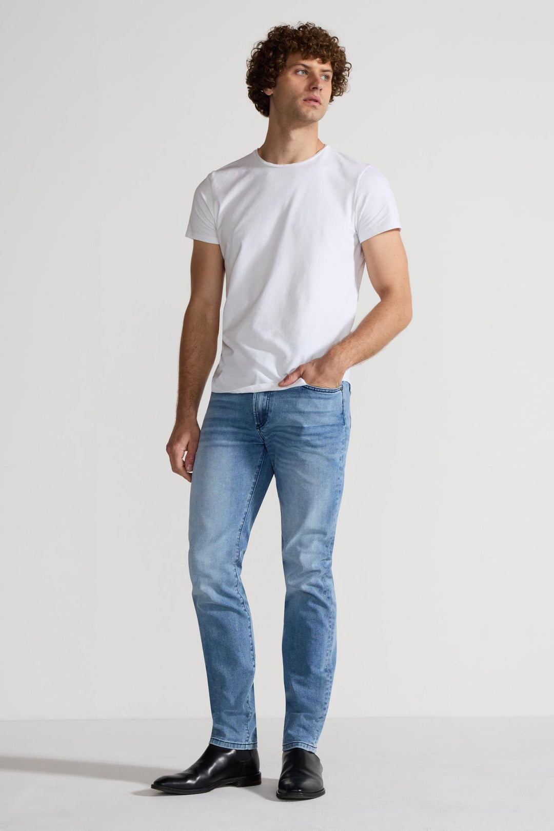 Model wearing MONFRÈRE Brando Florentine men's blue Japanese stretch denim five pocket slim jean.