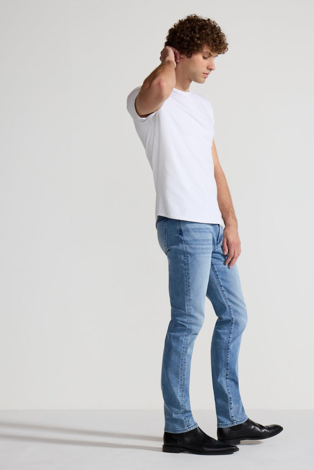 Side profile of MONFRÈRE Brando Florentine men's blue Japanese stretch denim five pocket slim jean.
