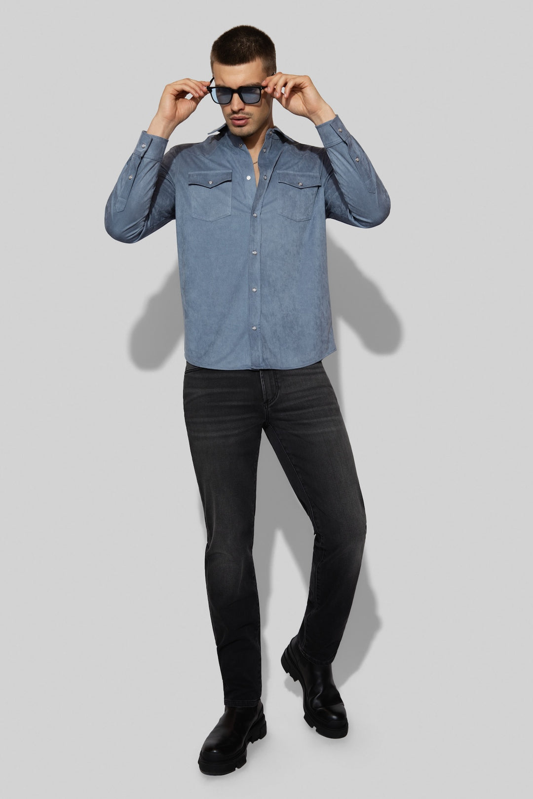 Model wearing MONFRÈRE Brando French Terry Matter men's dark grey French Terry denim five pocket slim jean.