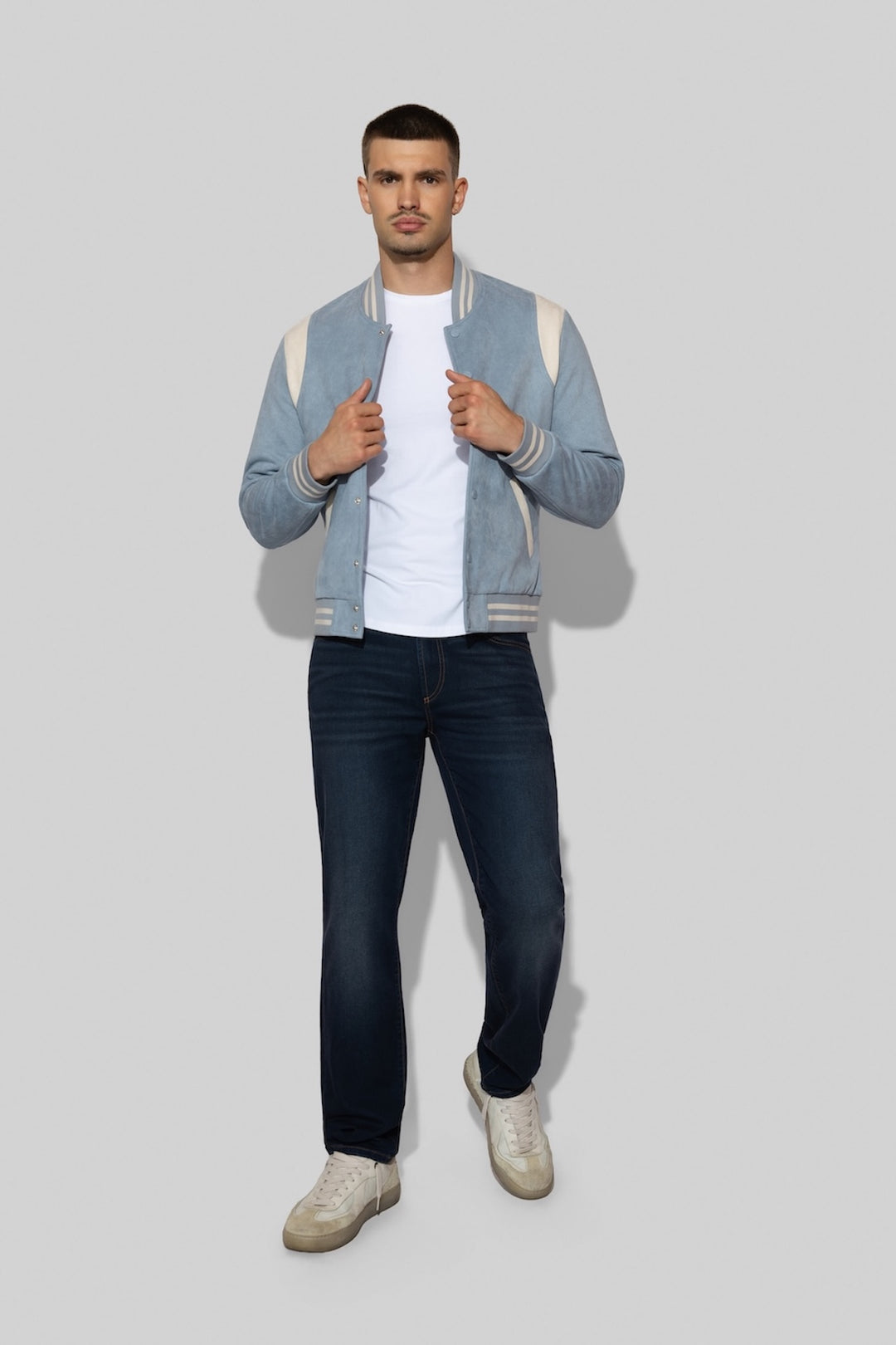 Model wearing MONFRÈRE Brando French Terry Wrangler men's dark blue French Terry denim five pocket slim jean.