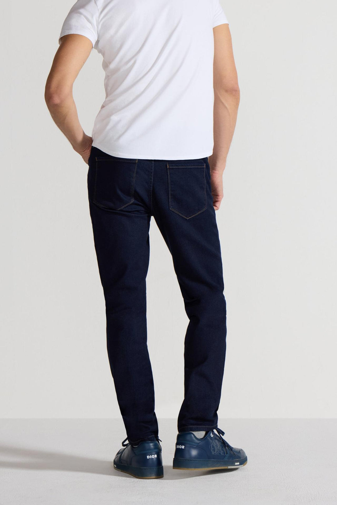 Back profile of MONFRÈRE Brando Indigo men's dark blue Japanese stretch denim five pocket slim jean.