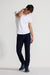Model wearing MONFRÈRE Brando Indigo men's dark blue Japanese stretch denim five pocket slim jean.
