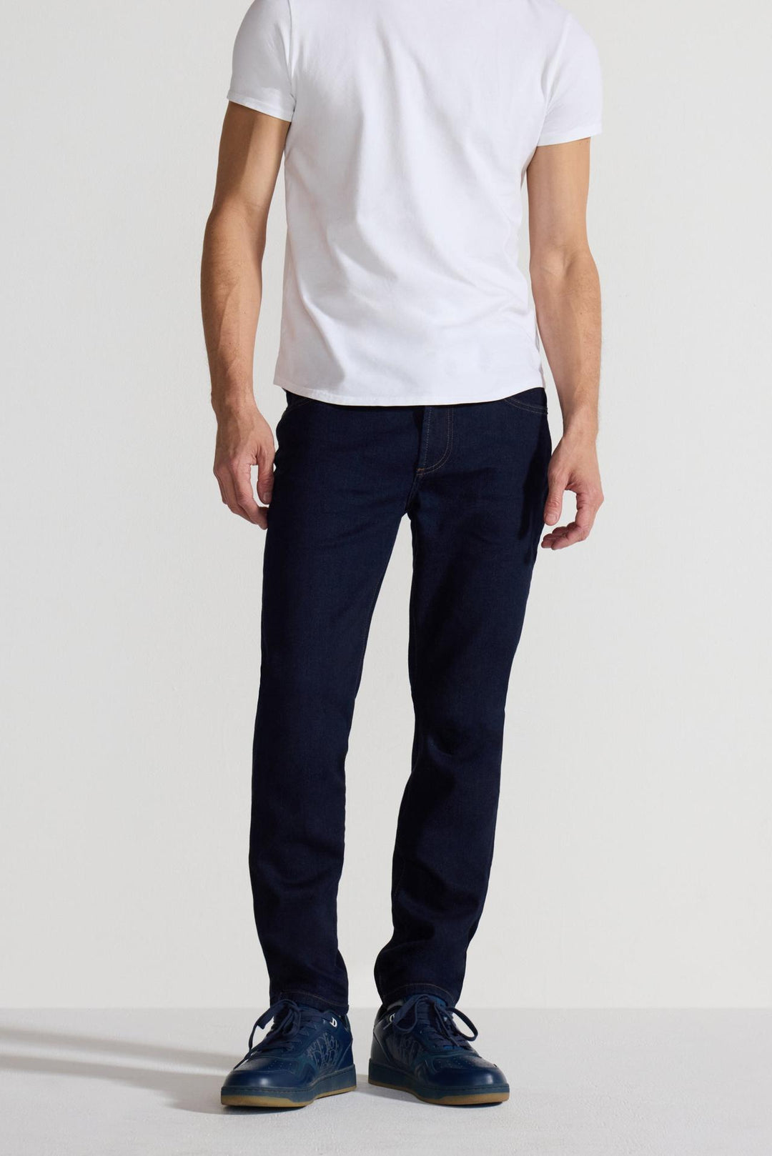 Front profile of MONFRÈRE Brando Indigo men's dark blue Japanese stretch denim five pocket slim jean.