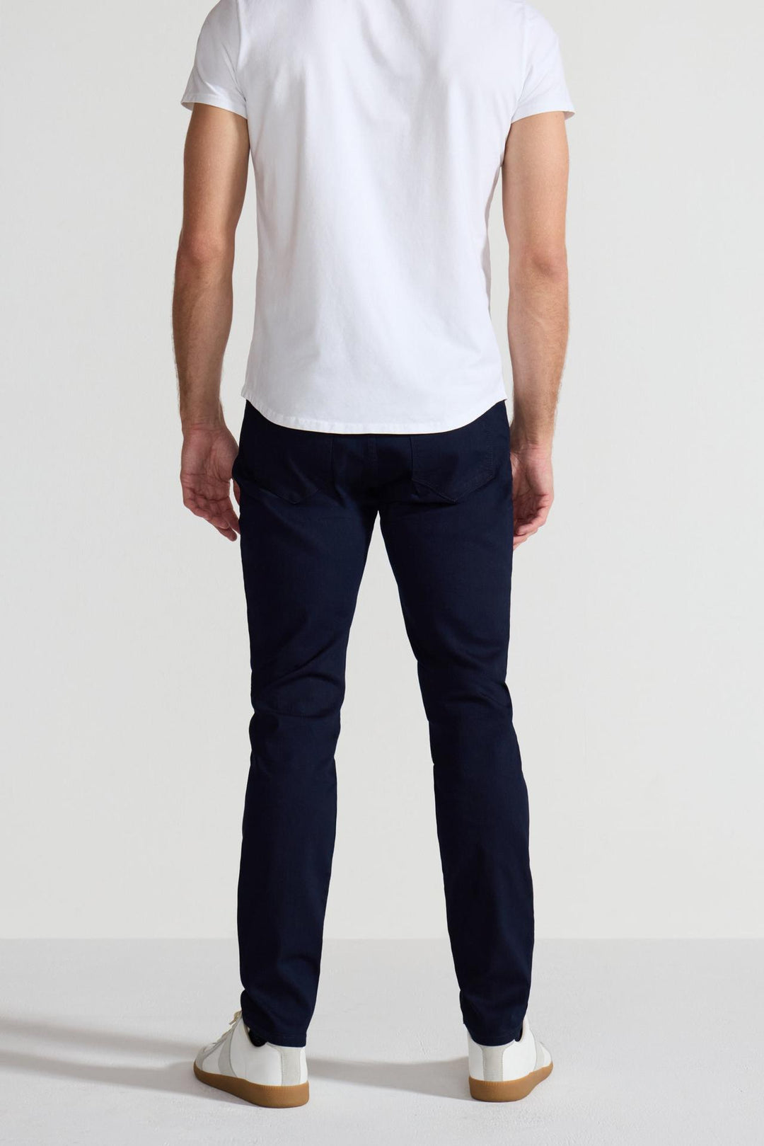 Back profile of MONFRÈRE Brando Ink men's dark blue navy Japanese stretch denim five pocket slim jean.