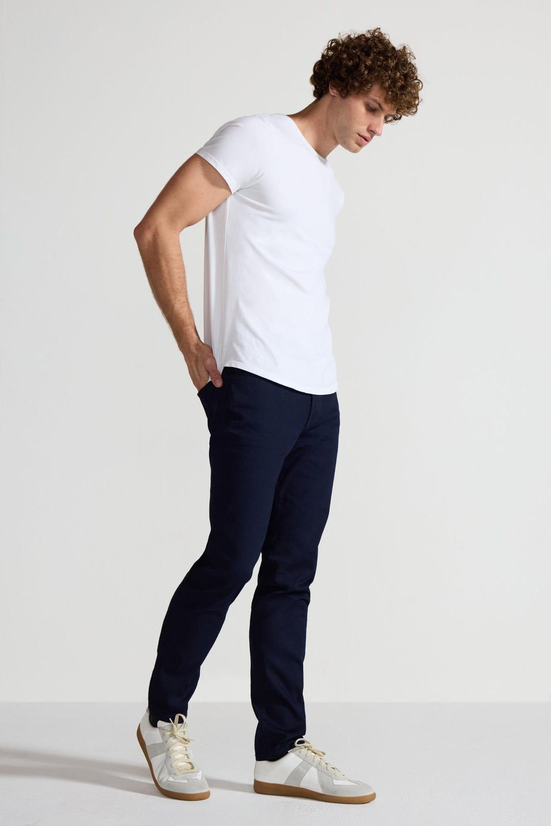 Side profile of MONFRÈRE Brando Ink men's dark blue navy Japanese stretch denim five pocket slim jean.