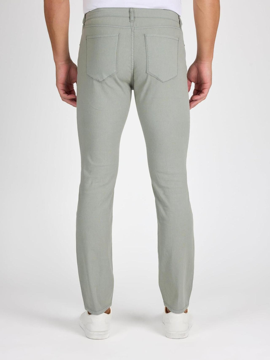 Back profile of MONFRÈRE Brando Jade men's green stretch twill five pocket slim jean.