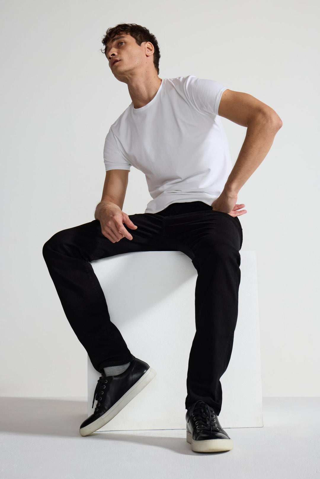 Detail view of MONFRÈRE Brando Noir men's black Japanese stretch denim five pocket slim jean.