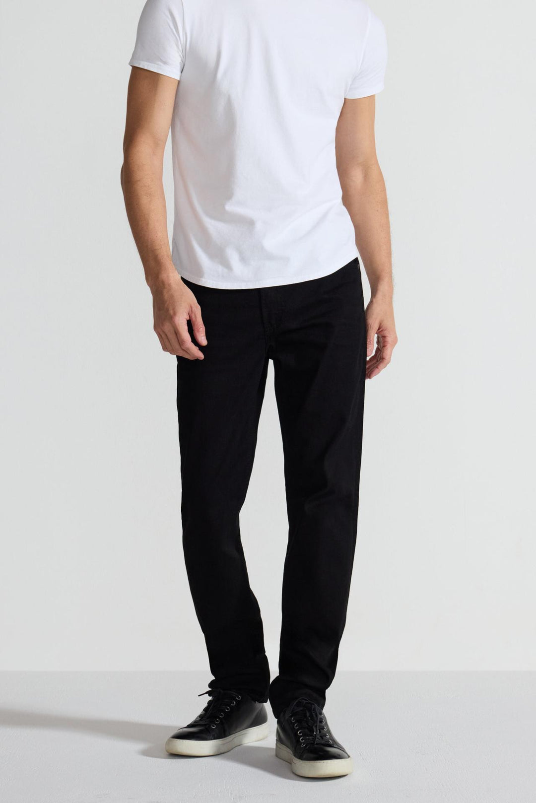 Front profile of MONFRÈRE Brando Noir men's black Japanese stretch denim five pocket slim jean.