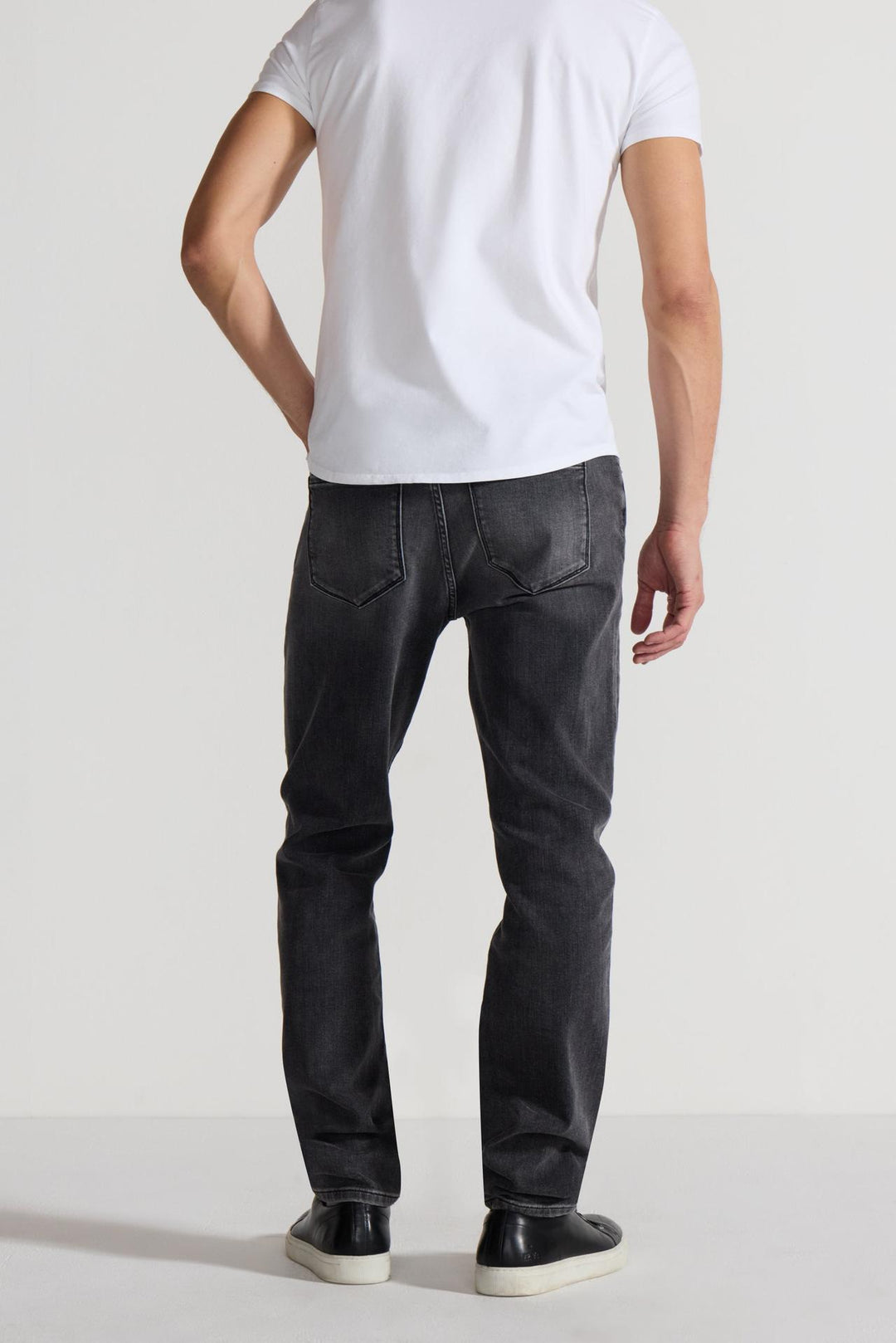 Back profile of MONFRÈRE Brando Oakland men's grey Japanese stretch denim five pocket slim jean.