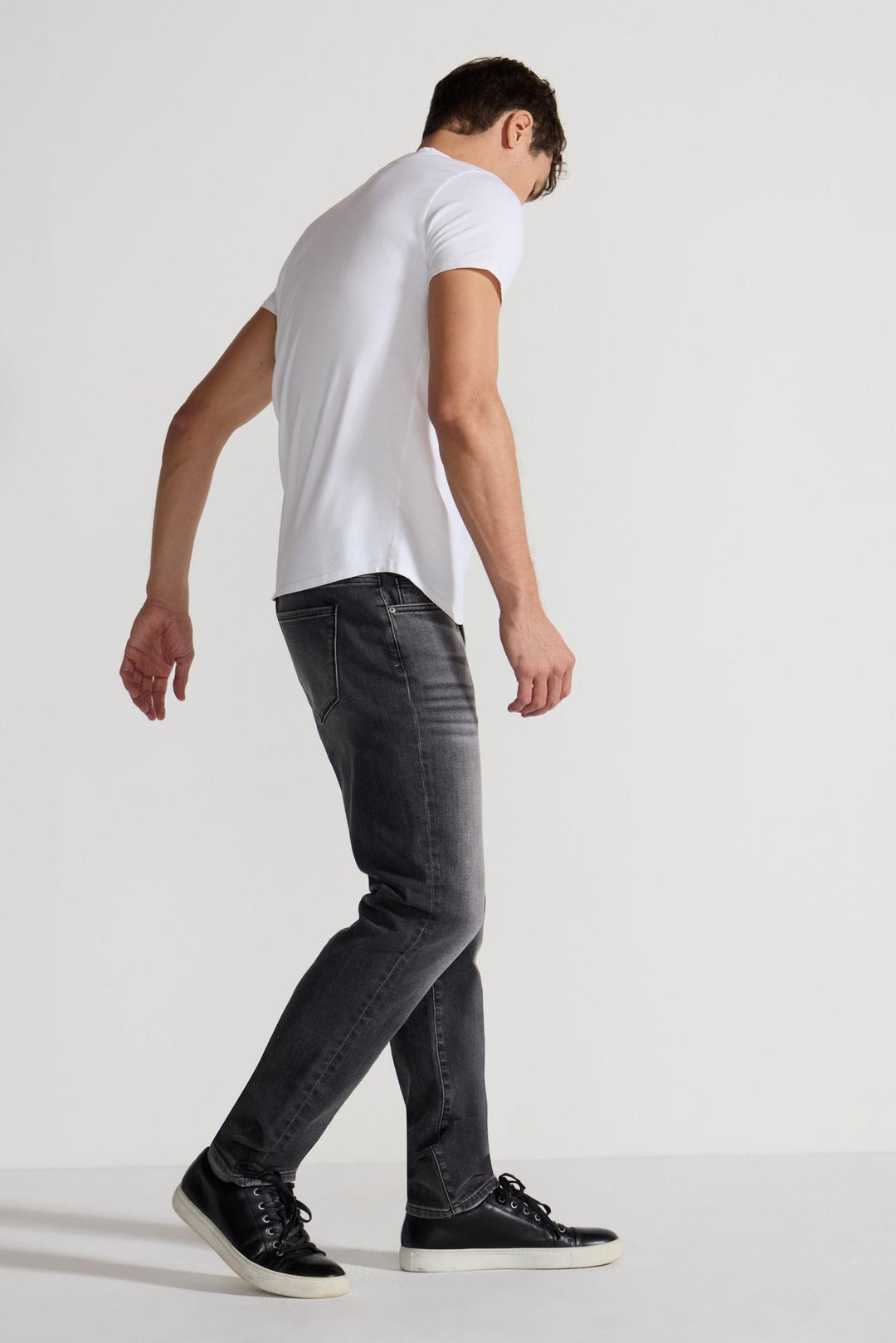 Side profile of MONFRÈRE Brando Oakland men's grey Japanese stretch denim five pocket slim jean.