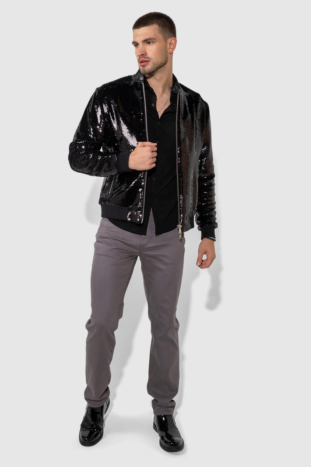 Model wearing MONFRÈRE Brando Parisian Luxe Eiffel Tower men's grey soft stretch twill five pocket slim jean.