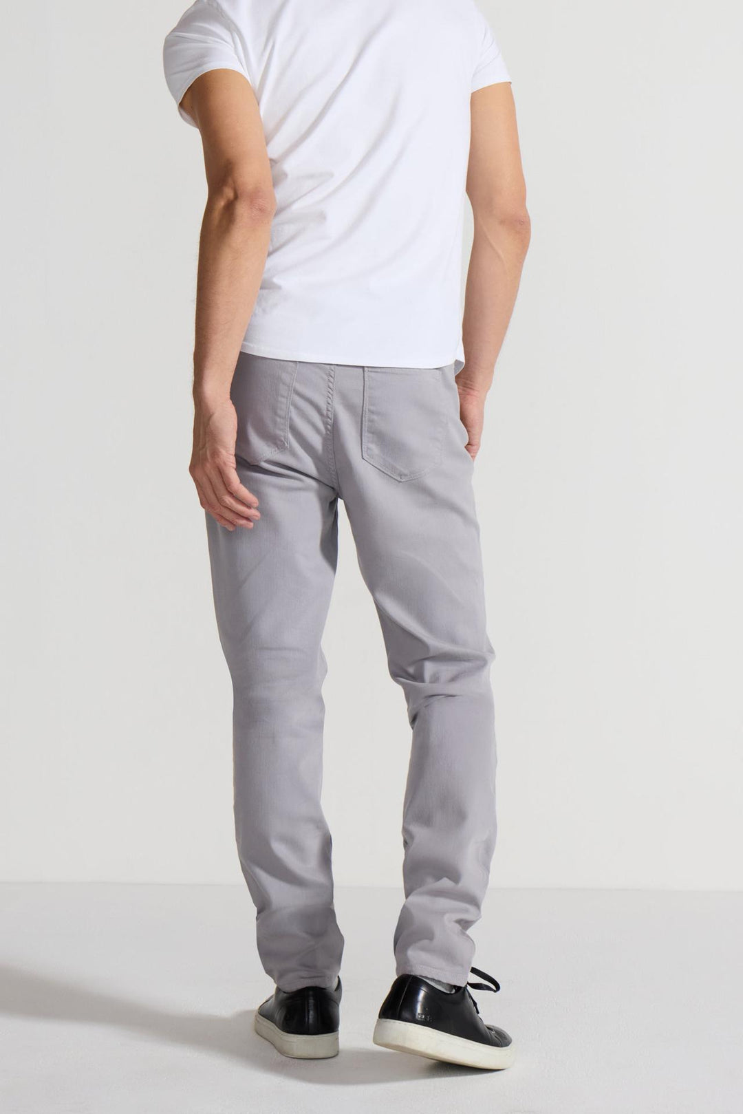 Back profile of MONFRÈRE Brando Parisian Luxe Light Grey men's grey soft stretch twill five pocket slim jean.
