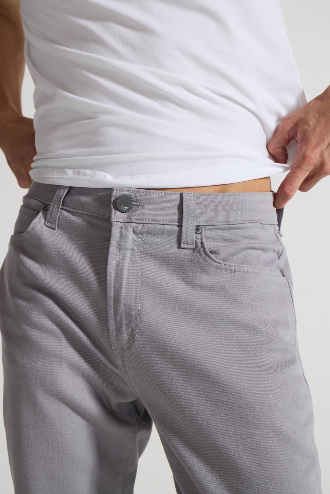 Detail view of MONFRÈRE Brando Parisian Luxe Light Grey men's grey soft stretch twill five pocket slim jean.