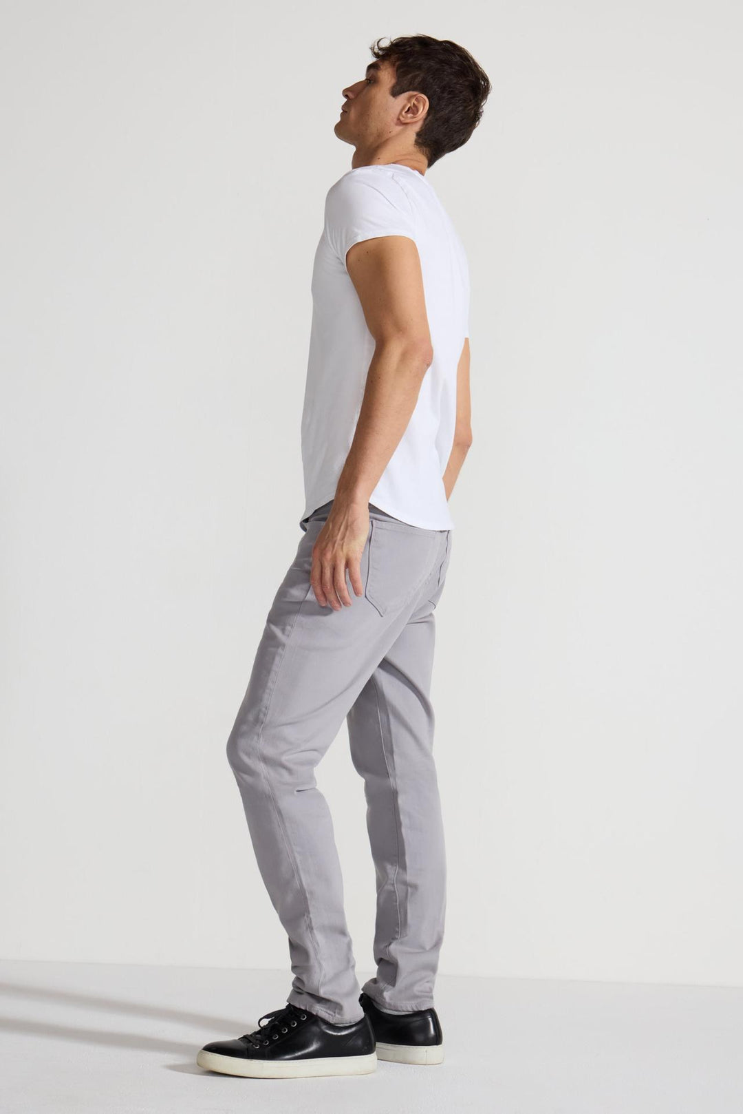 Side profile of MONFRÈRE Brando Parisian Luxe Light Grey men's grey soft stretch twill five pocket slim jean.