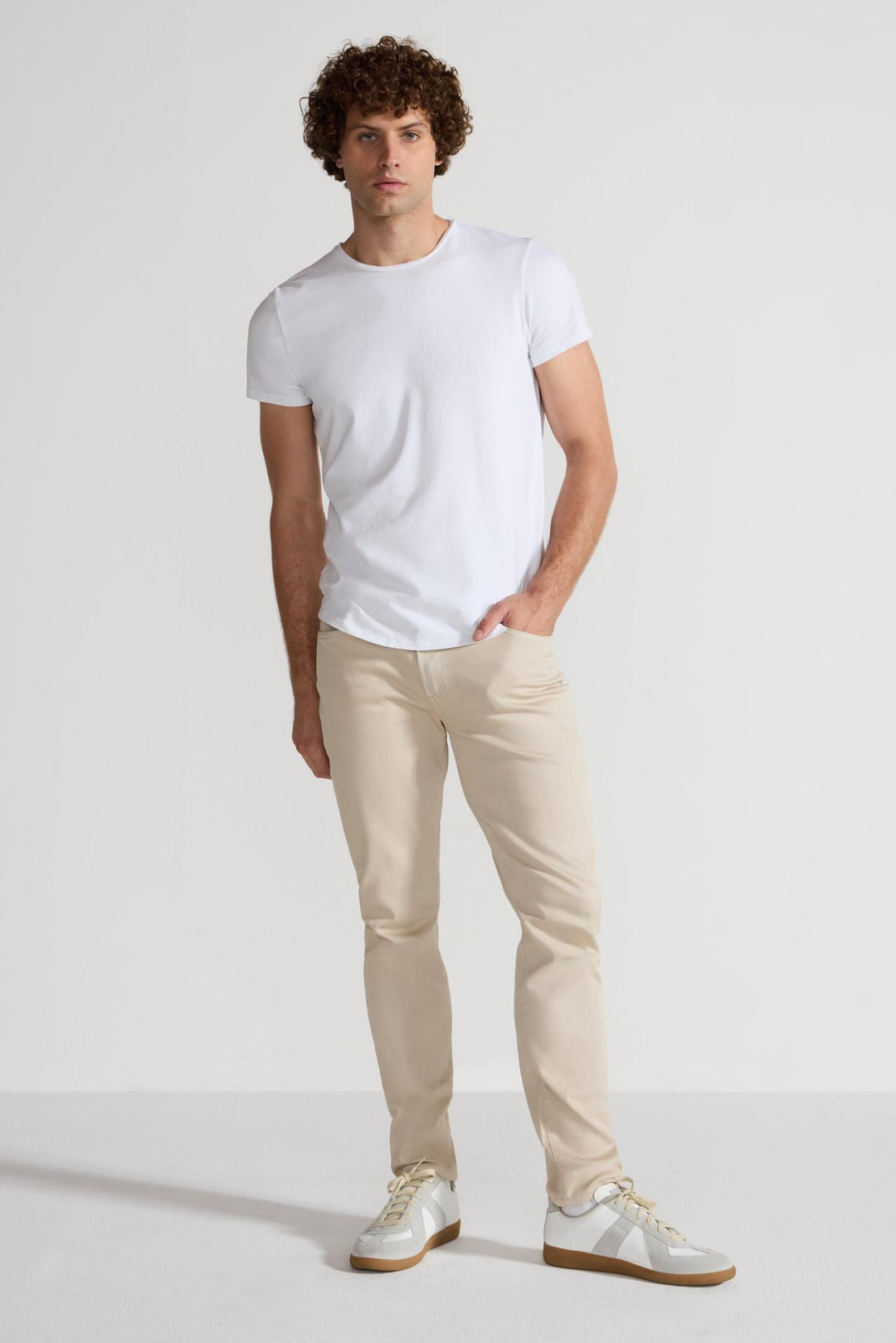 Model wearing MONFRÈRE Brando Parisian Luxe Khaki men's khaki soft stretch twill five pocket slim jean.