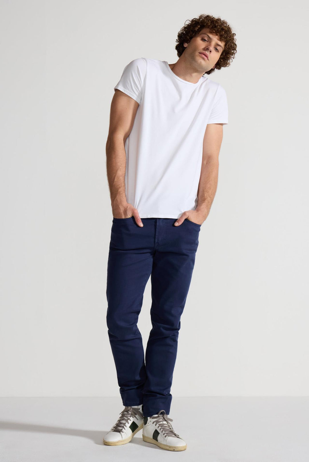 Model wearing MONFRÈRE Brando Parisian Luxe Navy men's blue soft stretch twill five pocket slim jean.