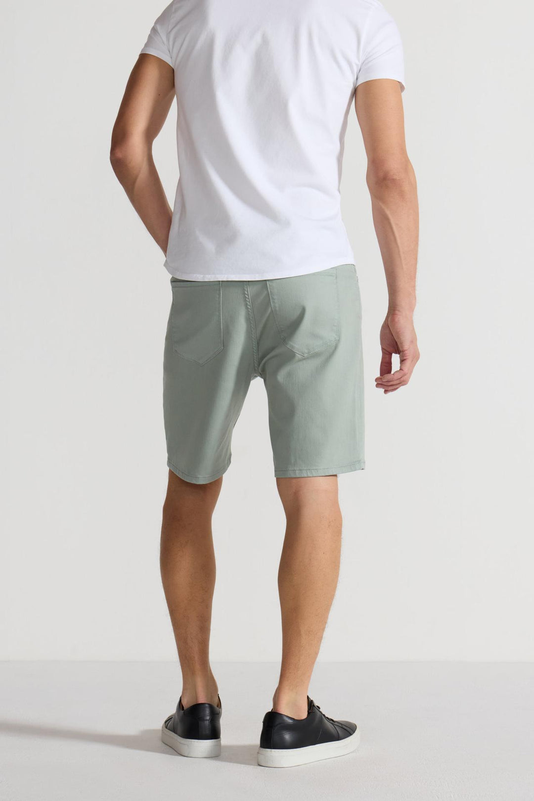 Back profile of MONFRÈRE Brando Short Mineral Green men's green soft stretch twill five pocket short.