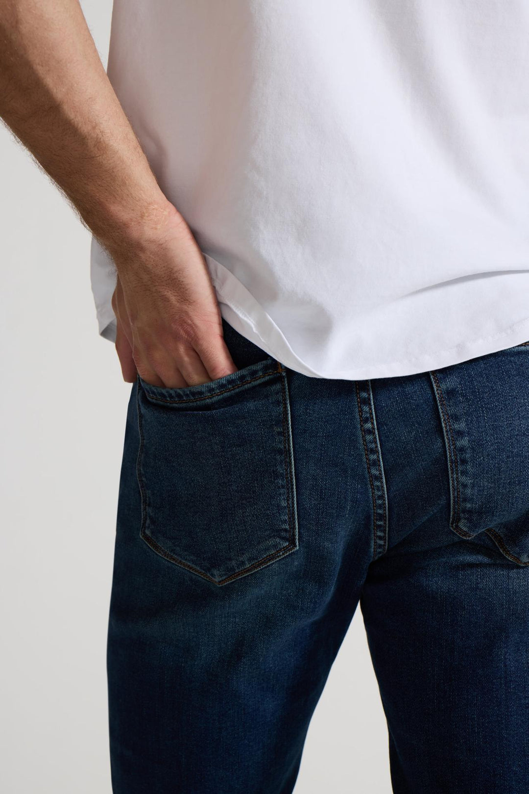 Close up of view MONFRÈRE Brando Tinted Indigo men's dark blue Japanese stretch denim five pocket slim jean.