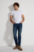 Model wearing MONFRÈRE Brando Tinted Indigo men's dark blue Japanese stretch denim five pocket slim jean.