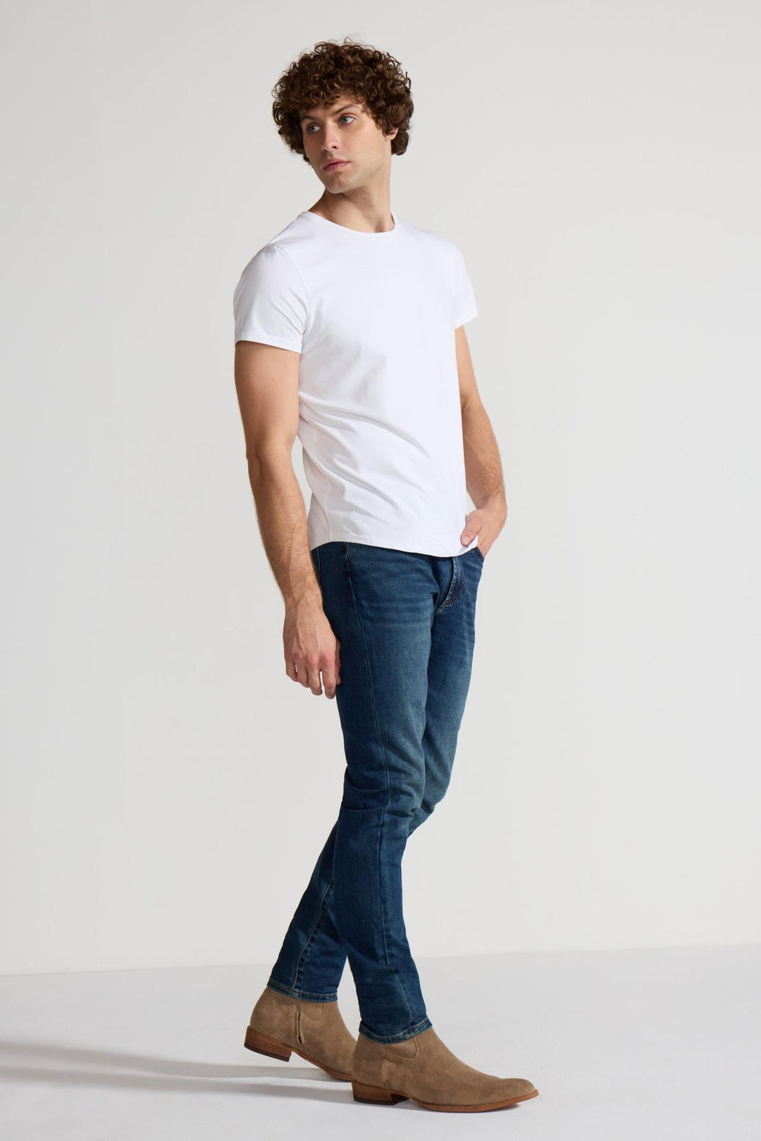 Side profile of MONFRÈRE Brando Tinted Indigo men's dark blue Japanese stretch denim five pocket slim jean.