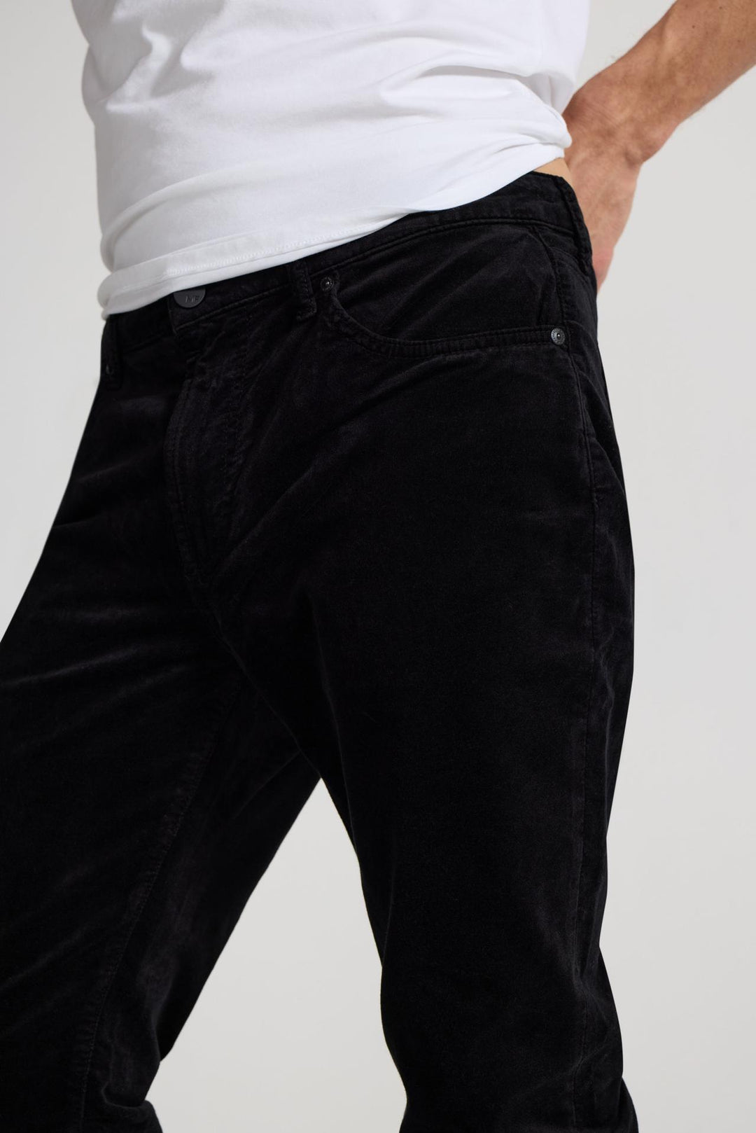Close up of view MONFRÈRE Brando Velvet Noir men's black velveteen stretch fabric five pocket slim jean.