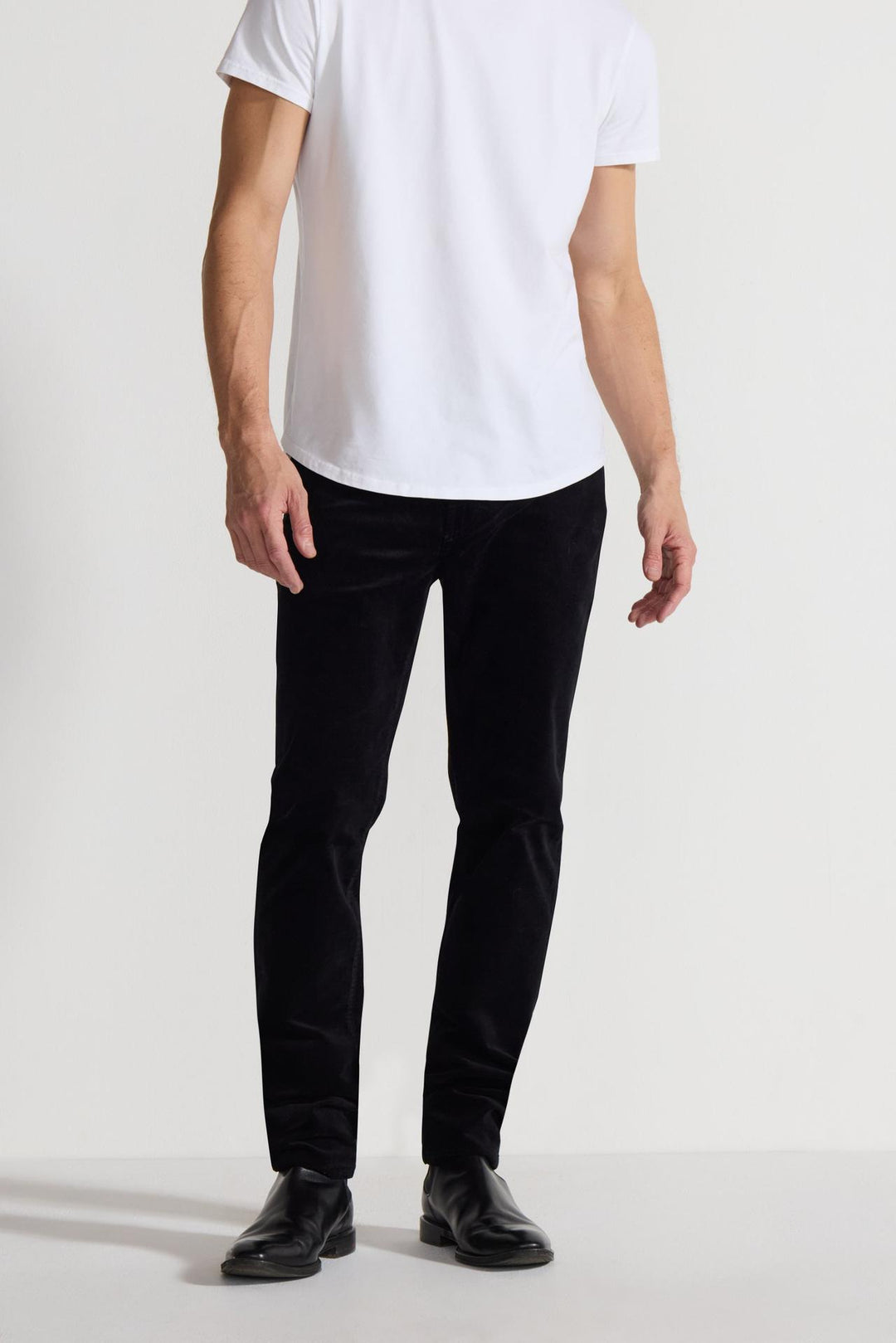 Front profile of MONFRÈRE Brando Velvet Noir men's black velveteen stretch fabric five pocket slim jean.