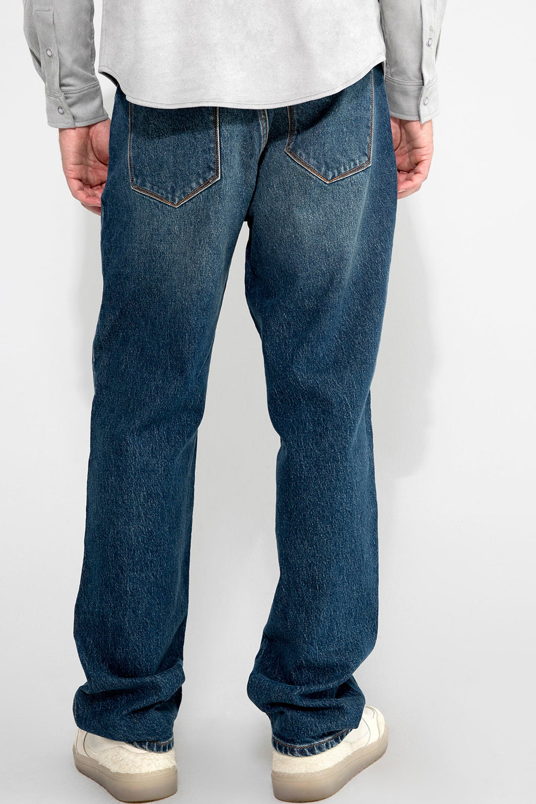 Back profile of MONFRÈRE Caine Clichy men's blue stretch rigid vintage denim five pocket straight leg relaxed jean.