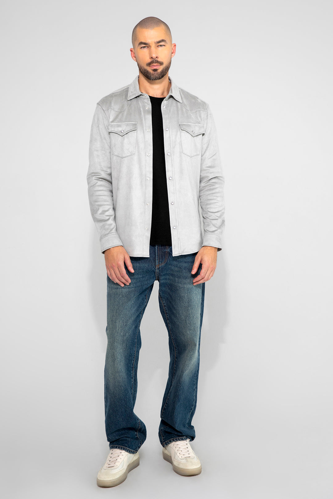 Model wearing MONFRÈRE Caine Clichy men's blue stretch rigid vintage denim five pocket straight leg relaxed jean.