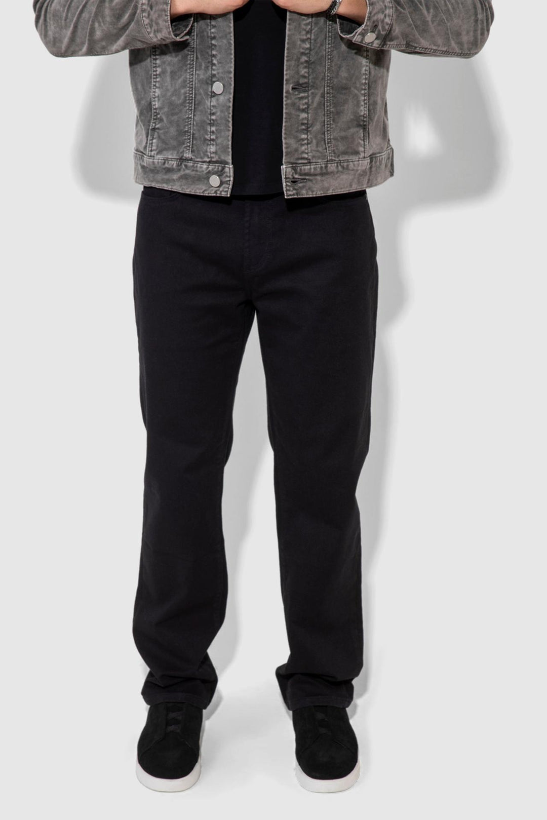 Front profile of MONFRÈRE Caine Noir men's black Japanese stretch denim five pocket straight leg relaxed jean.