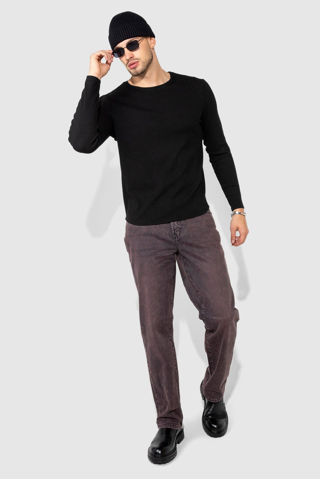 Model wearing MONFRÈRE Caine Vintage Plum men's purple stretch sateen twill five pocket straight leg relaxed jean.