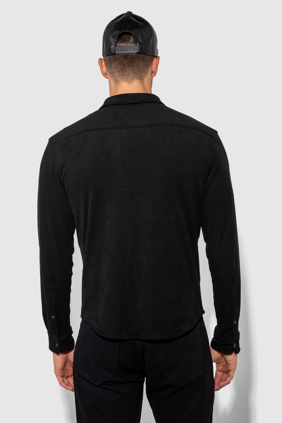 Back profile of MONFRÈRE Cooper Butter Suede Noir men's black soft faux suede stretch fabric button down shirt.