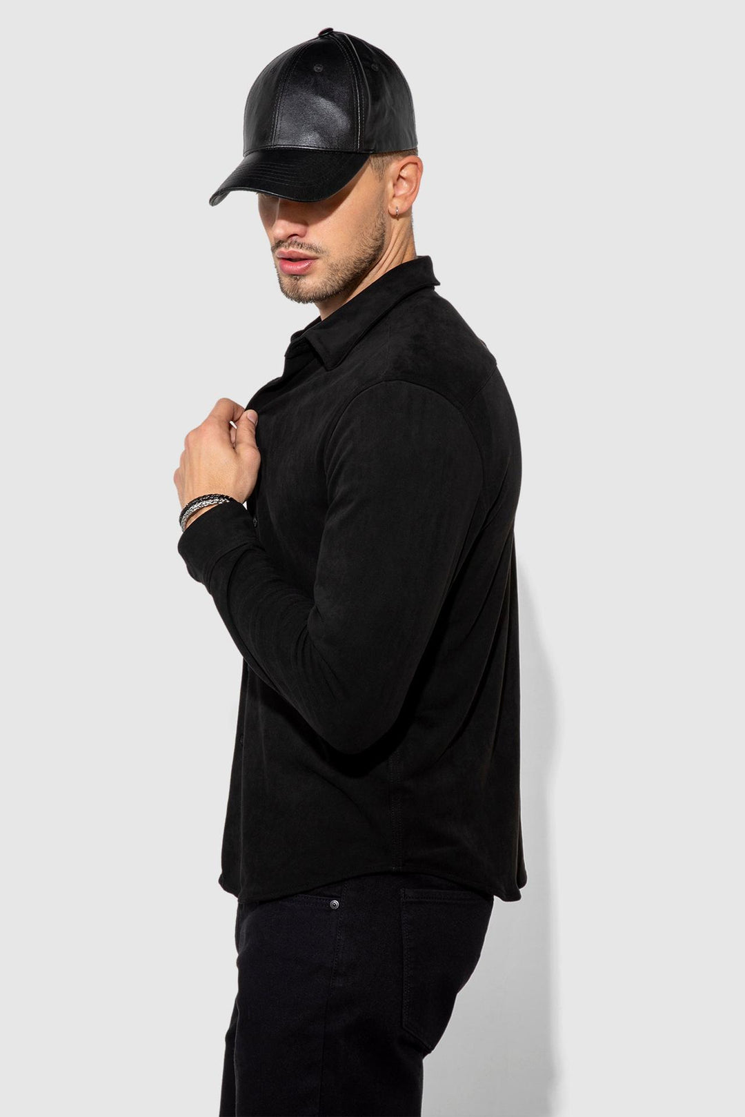Side profile of MONFRÈRE Cooper Butter Suede Noir men's black soft faux suede stretch fabric button down shirt.
