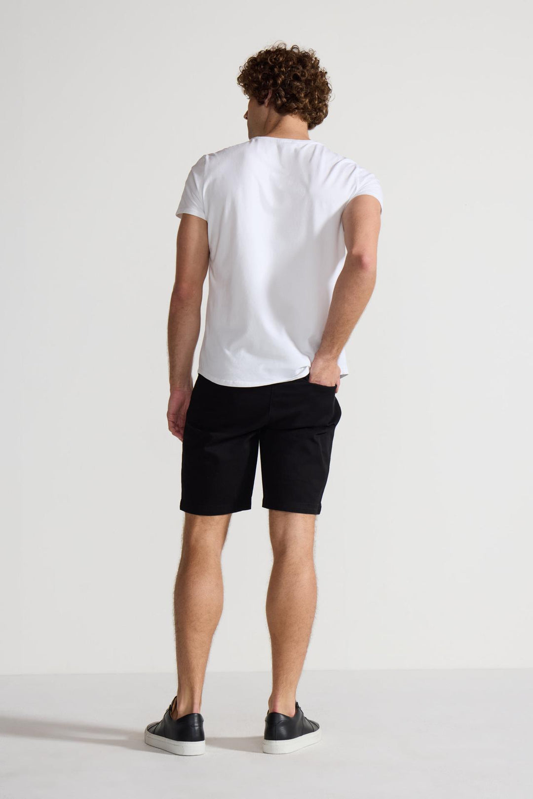 Back profile of MONFRÈRE Cruise Noir men's black Japanese tencel twill chino short.