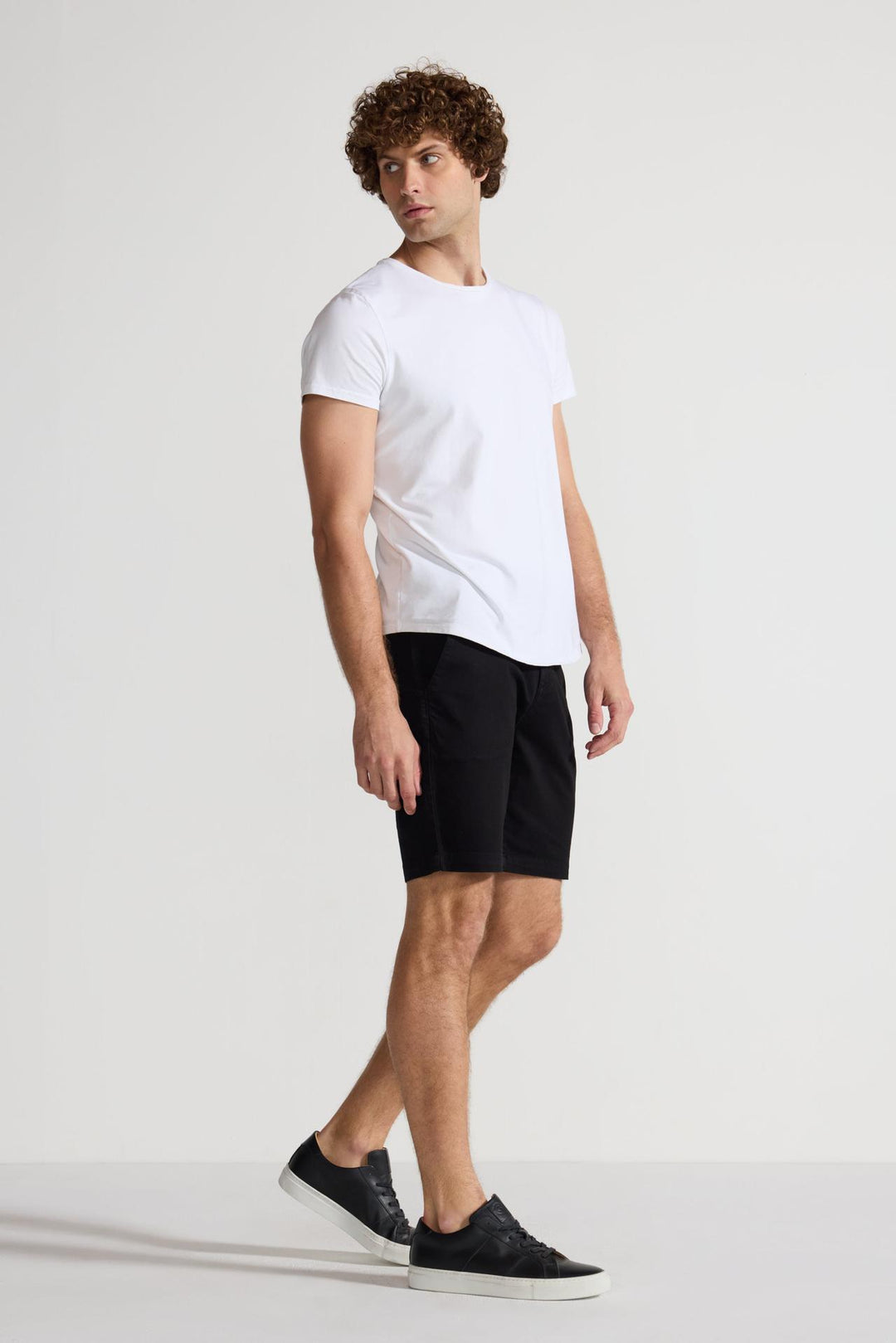 Side profile of MONFRÈRE Cruise Noir men's black Japanese tencel twill chino short.