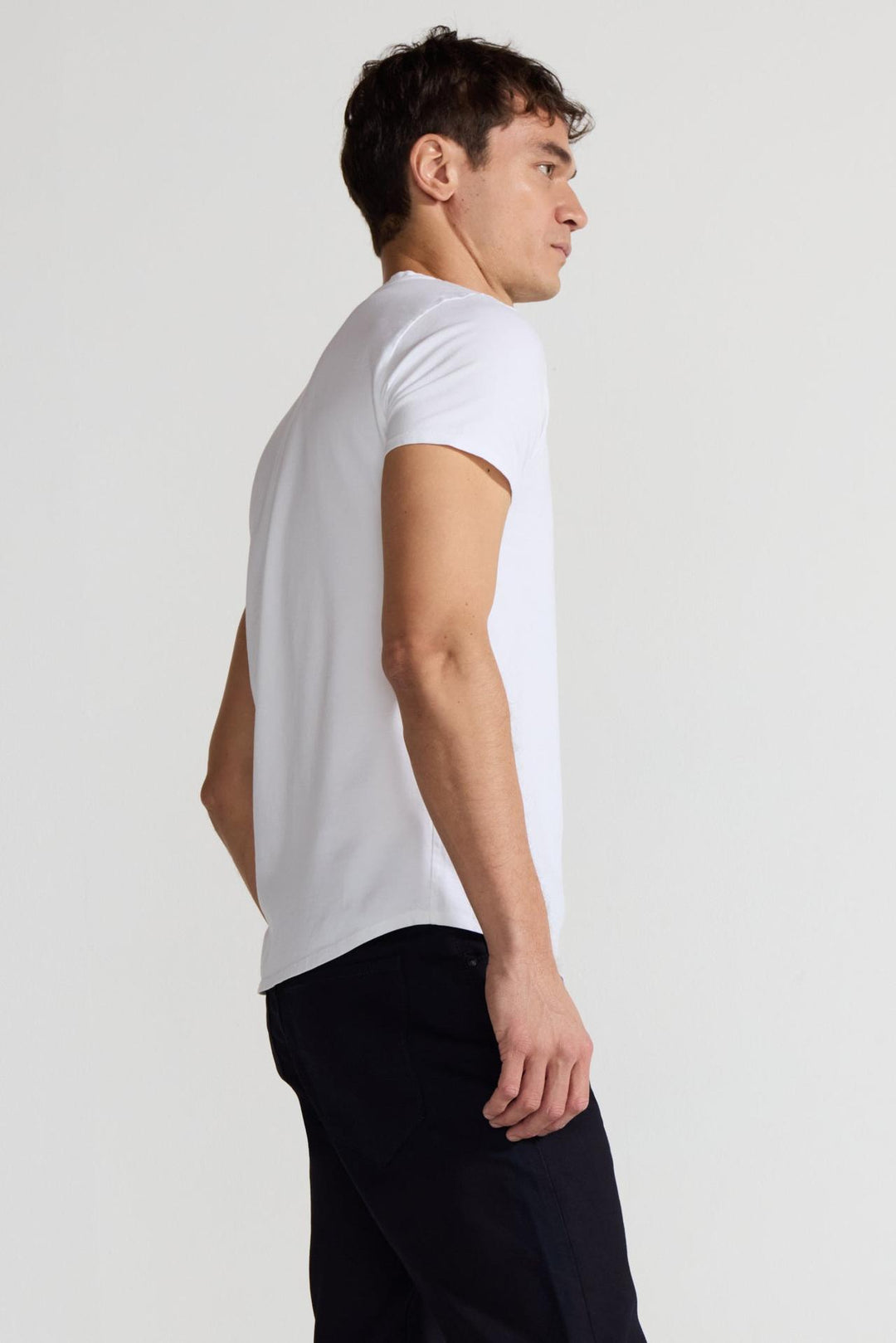 Side profile of MONFRÈRE Dann Blanc men's white stretch jersey knit short sleeve t-shirt.