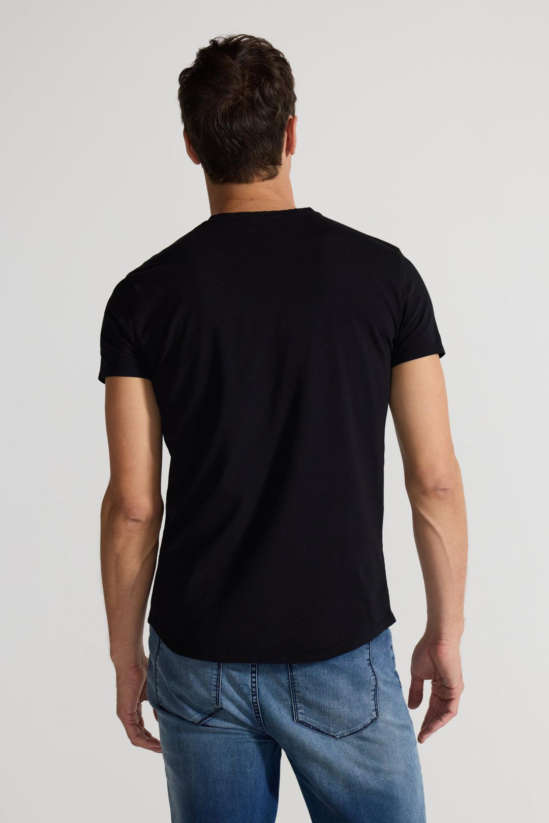 Back profile of MONFRÈRE Dann Noir men's black stretch jersey knit short sleeve t-shirt.