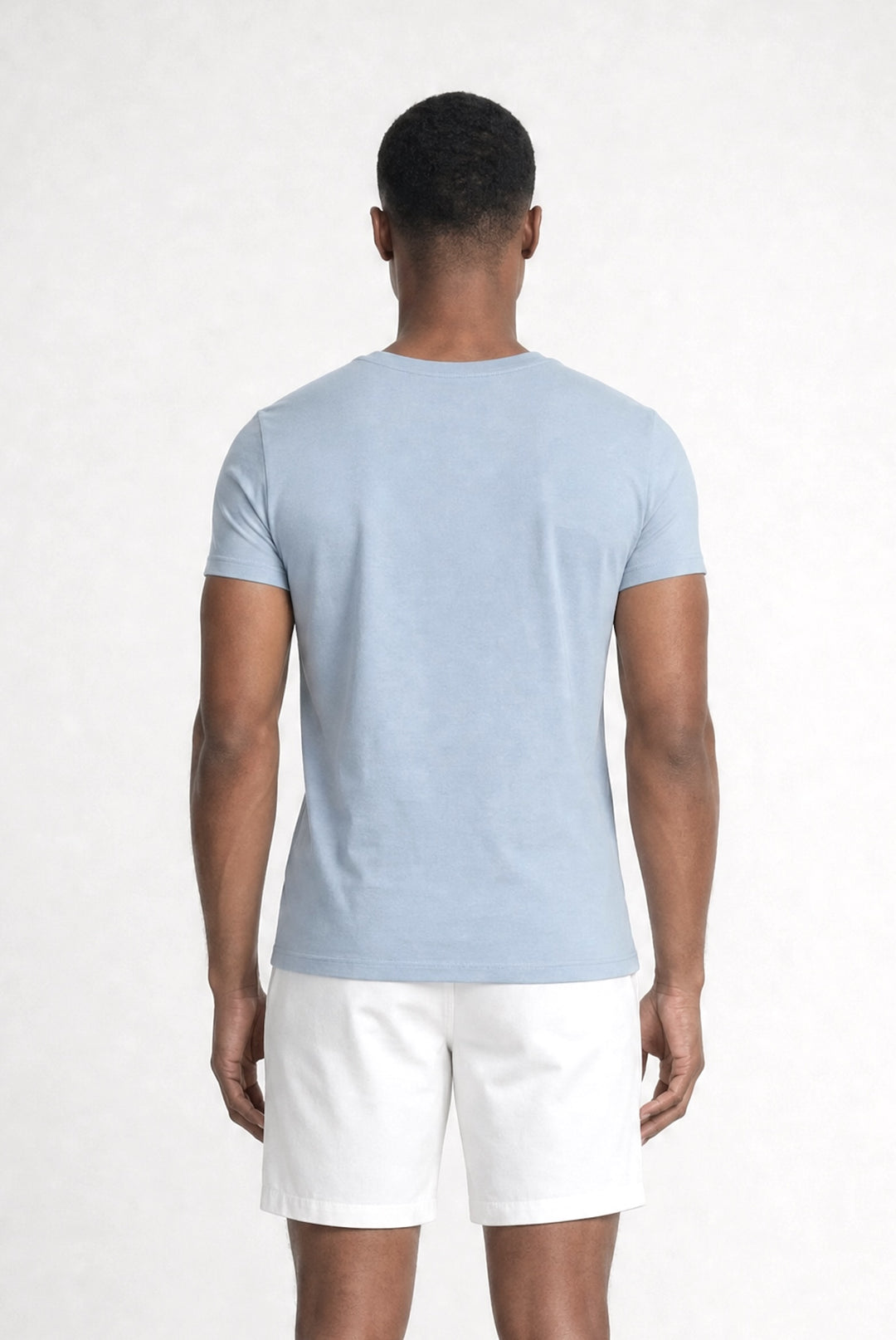 Back profile of MONFRÈRE Dann Steel Blue men's light blue stretch jersey knit short sleeve t-shirt.