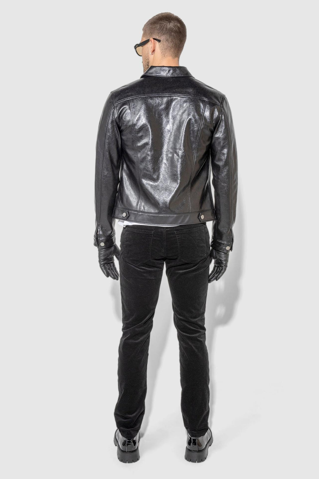 Detail view of MONFRÈRE Dean Patent Noir men's black stretch vegan leather trucker jacket.