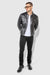 Model wearing MONFRÈRE Dean Patent Noir men's black stretch vegan leather trucker jacket.